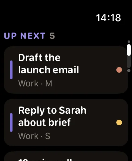 FocusDrop's Up next list on Apple Watch, 5 tasks in the deck: Draft the launch email (Work, M) and Reply to Sarah about brief (Work, S), with a third task below.